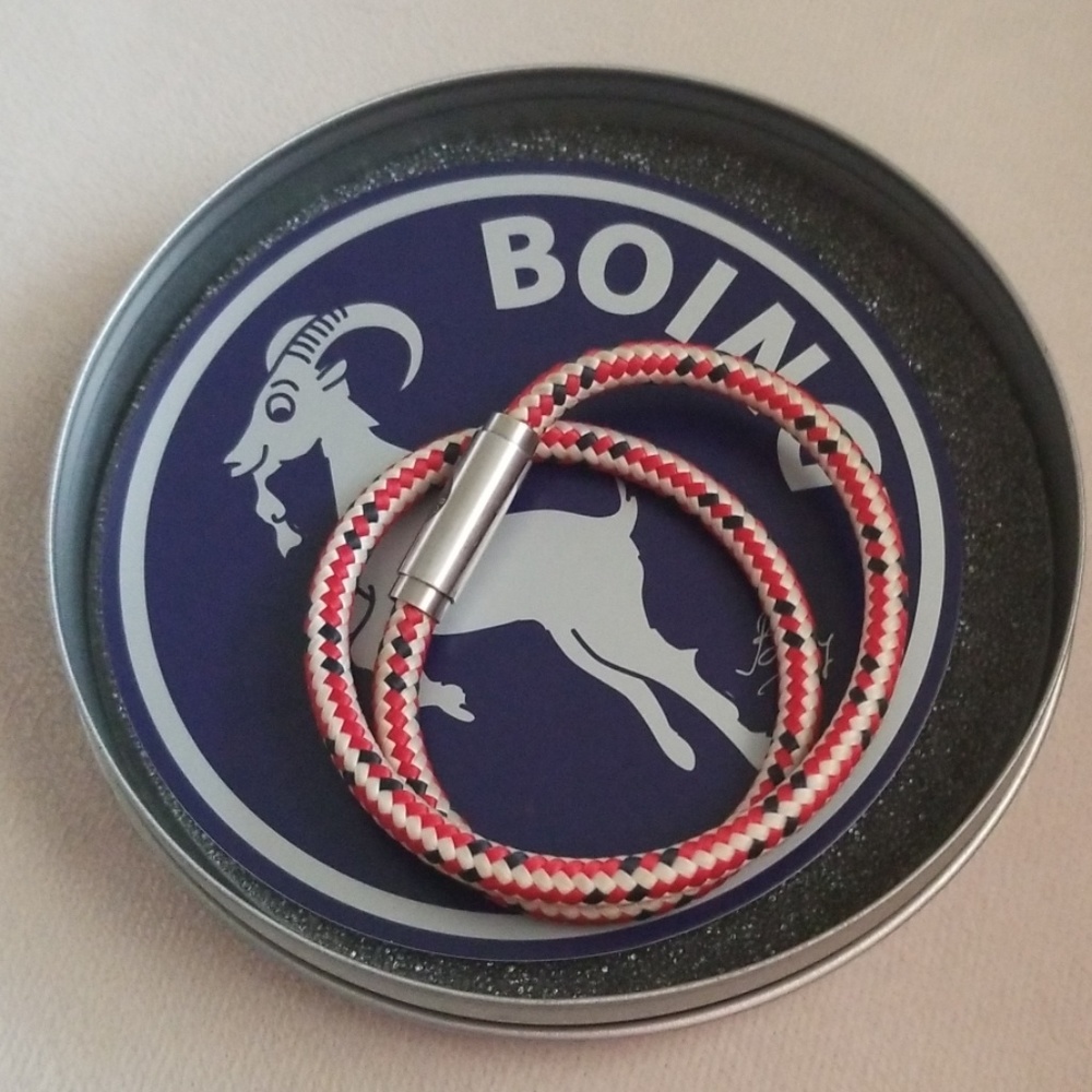 Boing necklace with case.